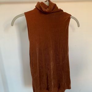 Dress Barn burnt orange sleeveless turtleneck.